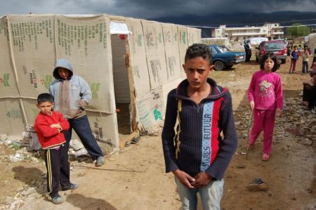Storm clouds gather over a Syrian refugee camp in Lebanon. Credit:  Andreas Zinggl/Caritas Austria