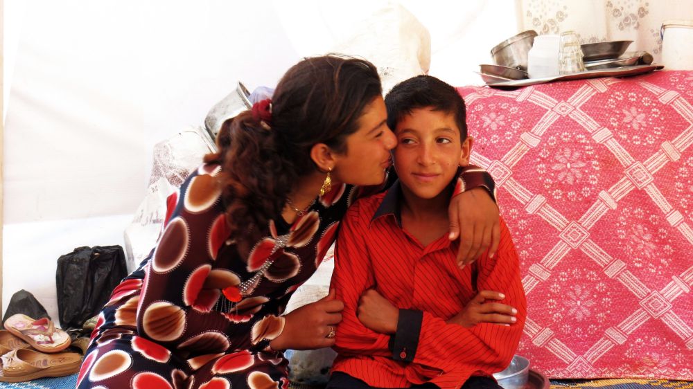 Gharam and Nafeh look after each other after they lost their mother. Photo by Patrick Nicholson/Caritas 