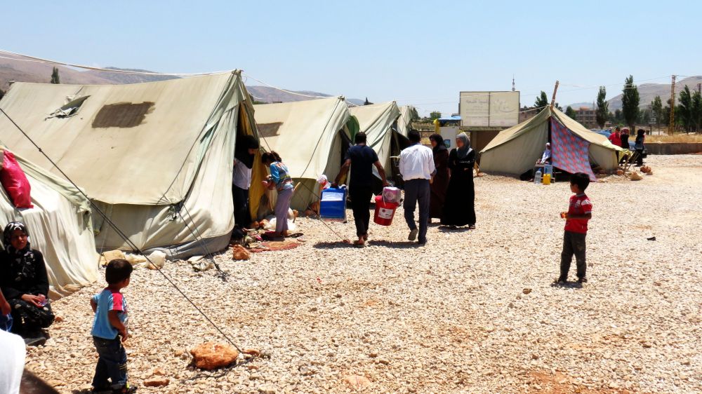 Caritas delivering aid in Bekaa Valley to Syrian refugees. Photo by Patrick Nicholson/Caritas